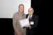 Dr. Nagib Callaos, General Chair, giving Prof. David A. Driskill the best paper award certificate of the session "Cybernetics (Communications and Control) ." The title of the awarded paper is "Urban Stage 2014: Actions and Outcomes from a Collaboration of Two Institutions and the Community."